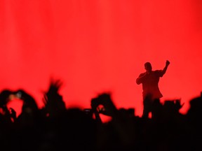 Kanye performs on stage during The Meadows Music & Arts Festival on October 2, 2016 in Queens, New York.