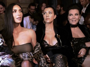 Kim Kardashian, left, with sister Kourtney Kardashian and mother Kris Jenner at the Off-white 2017 spring/summer ready-to-wear collection fashion show in Paris last week.