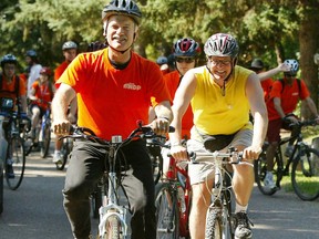 Former NDP leader Jack Layton participates in a fundraising bicycle ride in August 2005.