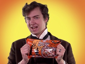 National Post correspondent Tristin Hopper braves close contact with a bag of Kerr's Molasses Kisses, the worst Halloween candy ever made.
