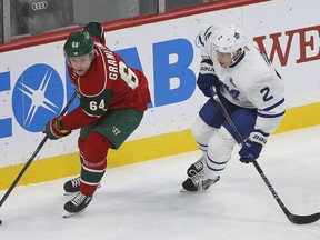 Minnesota Wild's Mikael Granlund controls the puck against Toronto Maple Leafs' Matt Hunwick in the first period of their game Thursday night in St. Paul, Minn.
