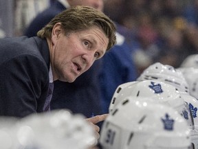 Toronto Maple Leafs head coach Mike Babcock speaks to his players as they take on the Ottawa Senators during the first period of an NHL pre-season hockey game in Saskatoon on Tuesday, Oct. 4, 2016.