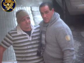 Juan Ramon Fernandez, right, is seen speaking with Giuseppe Carbone in Bagheria, Sicily shortly before Carbone helped kill him.