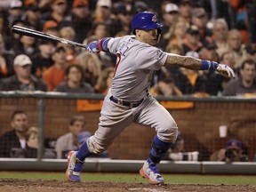 Chicago Cubs' Javier Baez hits a run-scoring single against the Giants during the ninth inning of Game 4 of the National League Division Series in San Francisco on Tuesday night.