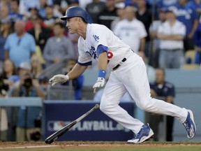 Chase Utley of the Dodgers watches his RBI single during the eighth inning in Game 4 of the National League Division Series against the Washington Nationals in Los Angeles on Tuesday.