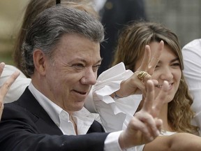 Colombia's President Juan Manuel Santos makes the victory sign, October 2, 2016