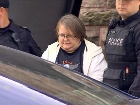 Elizabeth Wettlaufer is taken away by police in Woodstock, Ontario, on Tuesday Oct. 25, 2016.