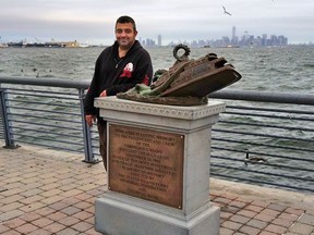 Artist Joseph Reginella stands with the monument dedicated to the victims of the Cornelius G. Kolff ferry sinking in New York. It took Reginella six months to execute his hoax.