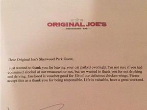 Letter left on a snow-covered vehicle left overnight in the parking lot of a Sherwood Park Original Joe's.