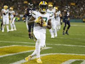 Davante Adams of the Green Bay Packers scores one of his two touchdowns on the night in the Packers 26-10 victory over the Chicago Bears in the Thursday night NFL game in Green Bay.