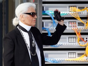 Fashion designer Karl Lagerfeld acknowledges the audience following the Chanel Spring 2017 collection show as part of Paris Fashion Week on October 4, 2016.