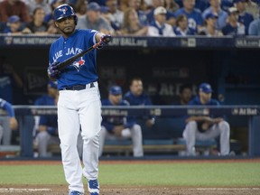 Toronto Blue Jays Edwin Encarnacion looks on after striking out against Cleveland in Game Four of the ALCS on Oct. 18.