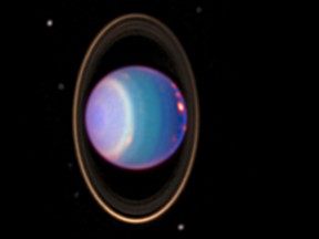 Hubble images of Uranus, which might have two more moons than we thought.