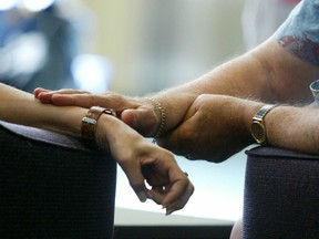 Two conventioners bond at the International Alcoholics Anonymous Convention in Toronto July 1, 2005.