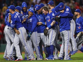 The Blue Jays celebrate clinching home-field advantage in the AL wild-card game after beating Boston 2-1 on Oct. 2.