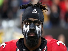 Calgary Stampeders defensive back Joshua Bell wears the initial of teammate Mylan Hicks on his face during Calgary's game against the Hamilton Tiger-Cats on Oct. 1.