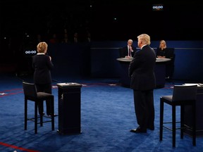 Clinton (left) speaks during the debate as Trump and moderators Anderson Cooper and Martha Raddatz listen on Oct. 9.