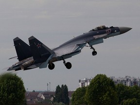 A Sukhoi Su-35 fighter jet takes off at the Paris Air Show June 16, 2013.
