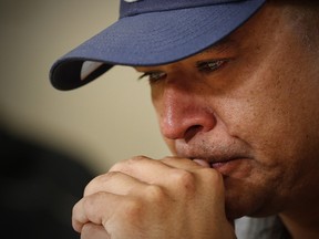 Norway House resident Leon Swanson weeps at a press conference in Winnipeg, on August 26. Swanson and David Tait Jr. were switched at birth in 1975 when their mothers gave birth at Norway House Indian Hospital.