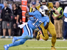 Wide receiver Kendall Wright of the Tennessee Titans makes his way to the end zone past a Jacksonville Jaguars defender during the Thursday night NFL game in Nashville, Tenn. The Titans improved their mark to 4-4 with a 36-22 victory over the Jags, now 2-5.