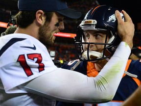 Houston Texans' quarterback Brock Osweiler, left, congratulates Denver Broncos' Trevor Siemian following the Broncos' 27-9 win in the Monday night NFL game in Denver. It was Osweiler's first game in Denver since leaving the Broncos to sign a free-agent deal with the Texans.