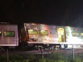 A Long Island Railroad train derailed near New Hyde Park, N.Y., Saturday. The commuter train derailed east of New York City after it hit a work train on the tracks.