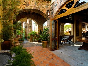 A courtyard offers a close-up look at the rock walls of the villa, Casa de la Torre, in Puerto Vallarta, Mexico.