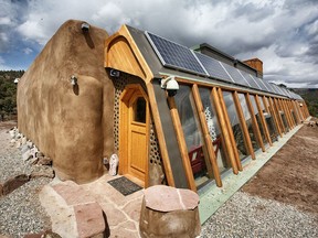 Private Earthship residence in Northern New Mexico. As with all Earthships, this home produces all of its own electricity with photovoltaic panels.
