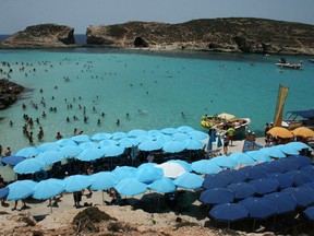 The Blue Lagoon is a popular swimming spot on the island of Comino, Malta.