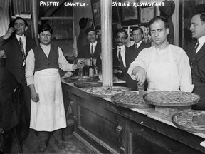 This 1910 photo shows a Syrian pastry counter in the Little Syria neighbourhood of Lower Manhattan in New York.