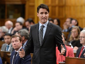 Prime Minister Justin Trudeau responds to a question regarding his speech at the start of the Paris Agreement debate in the House of Commons on Parliament Hill in Ottawa on Monday, Oct. 3, 2016.
