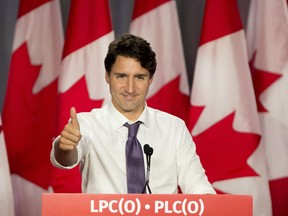 Prime Minister Justin Trudeau gives a thumbs up to the crowd during his speech at the Liberal Party of Canada's annual meeting in Niagara Falls, Ont., on Friday, October 21, 2016