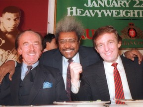 Donald Trump, right, with his father, Fred Trump, left, and boxing promoter Don King participate in news conference in Atlantic City, N.J., in 1987.