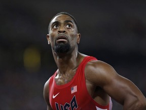 In this Aug. 23, 2015 file photo, Tyson Gay looks at his time after a men's 100-metre semi-final at the World Athletics Championships in Beijing.
