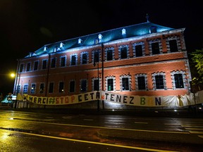 A banner reads "Thank you - stop CETA" on the facade of the Walloon parliament building in Namur, Belgium, on Oct.18, 2016.