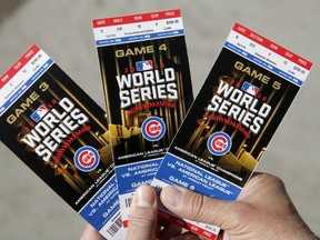 Chicago Cubs baseball fan Robert Lyons, who lives in Los Angeles and was raised in Berwyn, Ill., shows his World Series tickets.