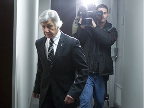 Dr Norman Barwin makes his way to the disciplinary hearing at the College of Physicians and Surgeons in Toronto on Thursday January 31, 2013, to answer allegations that he artificially inseminated three women with semen from somebody other than their chosen donor.