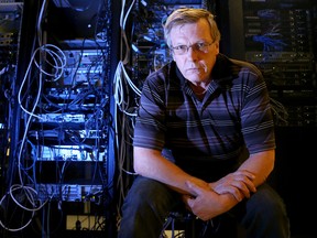 Grant Smith, a senior technical specialist with public works and government services, sits amidst a tangle of wires in a government data centre in Ottawa. All of Shared Services’ core projects are behind schedule, substantially so, in the case of email transformation.