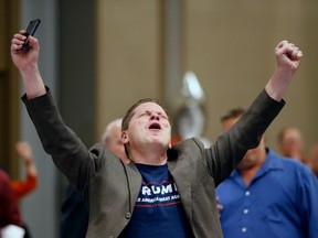 Trump supporter Grant Bynum raises his hands after hearing the news Trump won Ohio in the Presidential election during a Dallas County Republican watch party at the Westin Dallas Park Central hotel in Dallas, Texas late on Tuesday, Nov. 8, 2016.