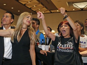 Trump supporters celebrate in Phoenix on election night. 'In the end, Donald Trump's voters showed up. It may be as simple as that. The coalition he always claimed didn't just turn out, it turned out in force in precisely the places he needed it most.'