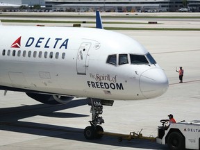 A Delta airlines plane is seen on the tarmac of the Fort Lauderdale-Hollywood International Airport on July 14, 2016 in Fort Lauderdale, Florida. Delta Air Lines Inc. reported that their second quarter earnings rose a better-than-expected 4.1%, and also announced that they decided to reduce its United States to Britian capacity on its winter schedule because of foreign currency issues and the economic uncertainty from Brexit.