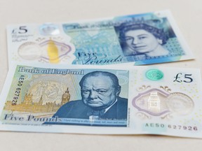 The new £5 (6.5 euros, $7.2) banknote bearing the image of wartime leader Winston Churchill is on show at its unveiling by the Bank of England at Blenheim Palace in Woodstock on June 2, 2016.    The note, to be rolled out from September, is the first to be printed on polymer -- a thin, flexible plastic film that is seen as more durable and secure and is already used in Australia and Canada. / AFP PHOTO / POOL / Joe GiddensJOE GIDDENS/AFP/Getty Images