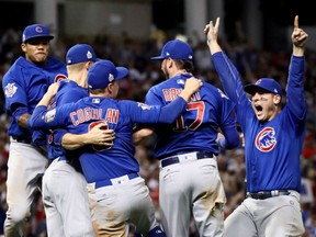 The Chicago Cubs celebrate after winning 8-7 against the Indians in Game 7 of the World Series at Progressive Field in Cleveland on Wednesday night. The Cubs won their first World Series in 108 years.