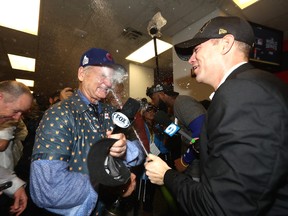 Actor Bill Murray (L) celebrates in the clubhouse with President of Baseball Operations for the Chicago Cubs Theo Epstein after the Cubs defeated the Cleveland Indians 8-7 in Game Seven of the 2016 World Series at Progressive Field on November 2, 2016 in Cleveland, Ohio.