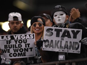 Oakland Raiders fans display signs in support of the team staying in Oakland during their game against the Denver Broncos at Oakland-Alameda County Coliseum on November 6, 2016 in Oakland, California.