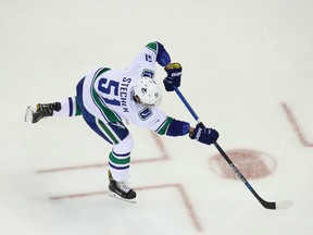 Vancouver Canucks defenceman Troy Stecher shoots in warm-up before a Nov. 8 game against the New York Rangers.