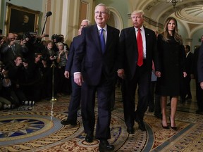 Senate Majority Leader Mitch McConnell, second left, walks with President-Elect Donald Trump, his wife Melania Trump and Vice President-elect Mike Pence, left, at the U.S. Capitol for a meeting on Nov. 10.
