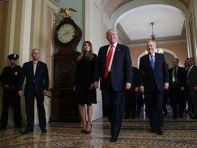 President-elect Donald Trump, (C), walks with his wife Melania Trump, and Senate Majority Leader Mitch McConnell (R) after a meeting at the U.S. Capitol November 10, 2016 in Washington, DC.