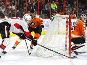 Kyle Turris of the Ottawa Senators scores a goal on goalie Steve Mason of the Philadelphia Flyers during the third period at Wells Fargo Center on Tuesday in Philadelphia.