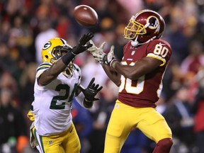 Wide receiver Jamison Crowder of Washington makes a catch past cornerback Josh Norman of the Green Bay Packers  in the third quarter at FedExField Sunday in Landover, Maryland. Washington won 42-24.
